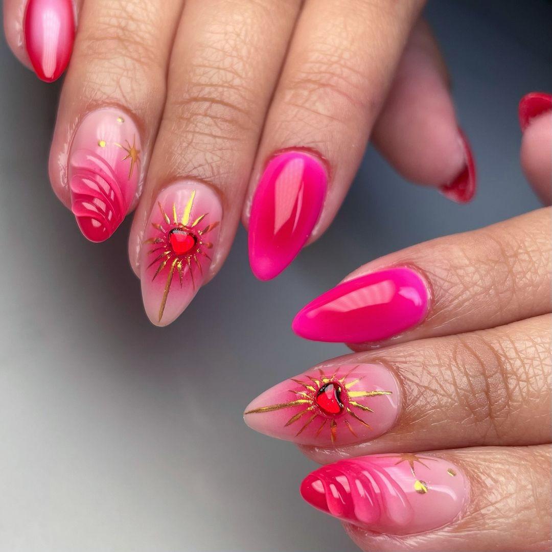 Hand with pink press-on nails, heart and star nail art, almond shape, glossy finish.